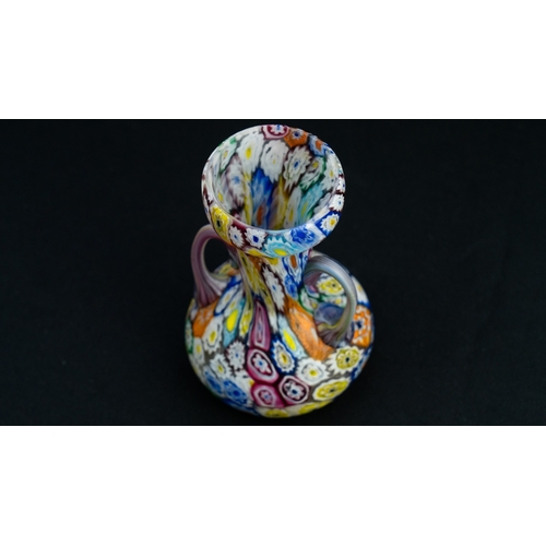 114 - A FRATELLI TOSO MURANO MILLEFIORI VASE
Of compressed bulbous shape, resting on a flat base, with a t... 