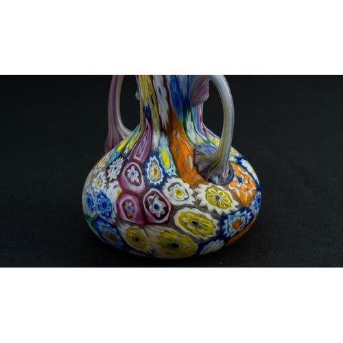 114 - A FRATELLI TOSO MURANO MILLEFIORI VASE
Of compressed bulbous shape, resting on a flat base, with a t... 