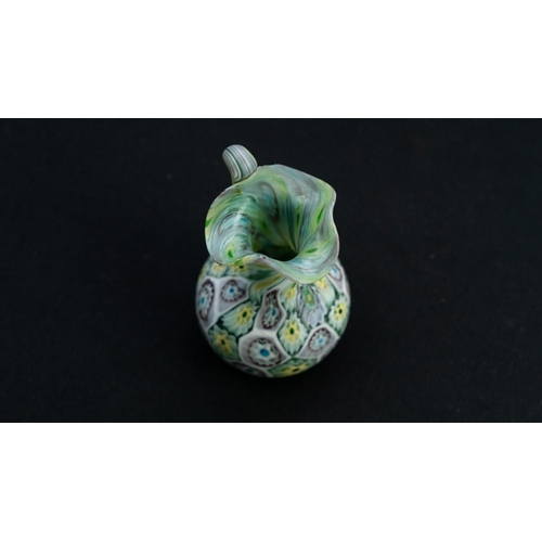 119 - A FRATELLI TOSO MURANO MILLEFIORI VASE
Of baluster shape, resting on a flat base, with a tall cylind... 