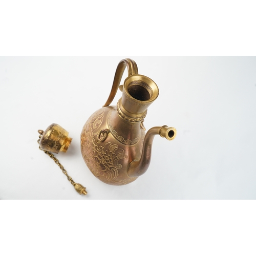 128 - A GILT-COPPER (TOMBAK) ZAM ZAM EWER
OTTOMAN
Of pyriform form, the tombak ewer on a splayed rounded f... 