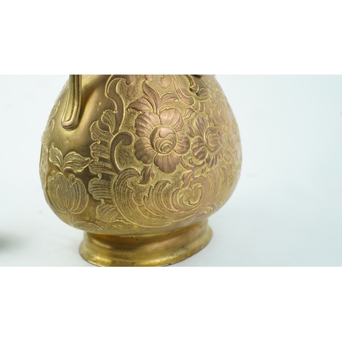 128 - A GILT-COPPER (TOMBAK) ZAM ZAM EWER
OTTOMAN
Of pyriform form, the tombak ewer on a splayed rounded f... 