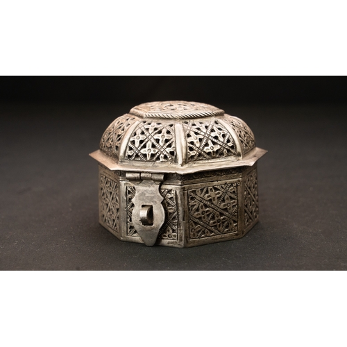 57 - A PIERCED SILVER BOX WITH DOMED LID, IRAN, LATE 19TH - EARLY 20TH CENTURY  Of octagonal form with do... 