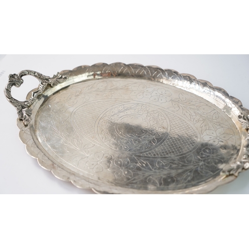 58 - AN OTTOMAN SILVER PLATE, TRAY  Of oval form with a scalloped cavetto, resting on a flat base, two ha... 