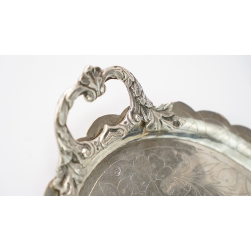 58 - AN OTTOMAN SILVER PLATE, TRAY  Of oval form with a scalloped cavetto, resting on a flat base, two ha... 