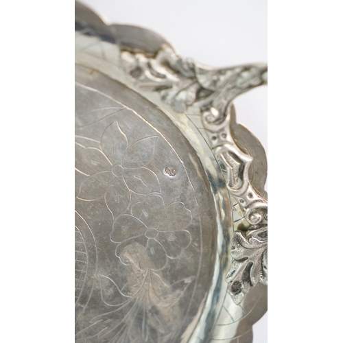 58 - AN OTTOMAN SILVER PLATE, TRAY  Of oval form with a scalloped cavetto, resting on a flat base, two ha... 