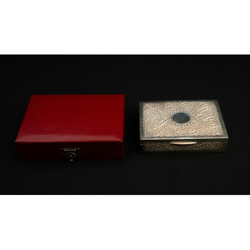 60 - A SILVER COVERED BOX IN A CASE  Of rectangular form, with a hinged lid, all over embossed decoration... 