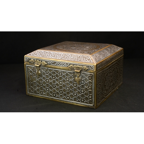 61 - A MAMLUK REVIVAL CAIROWARE SILVER INLAID BOX, POSSIBLY A QURAN BOX  Of square form with a hinged rai... 