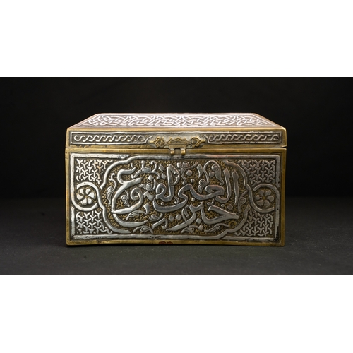 61 - A MAMLUK REVIVAL CAIROWARE SILVER INLAID BOX, POSSIBLY A QURAN BOX  Of square form with a hinged rai... 