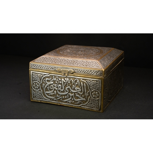 61 - A MAMLUK REVIVAL CAIROWARE SILVER INLAID BOX, POSSIBLY A QURAN BOX  Of square form with a hinged rai... 