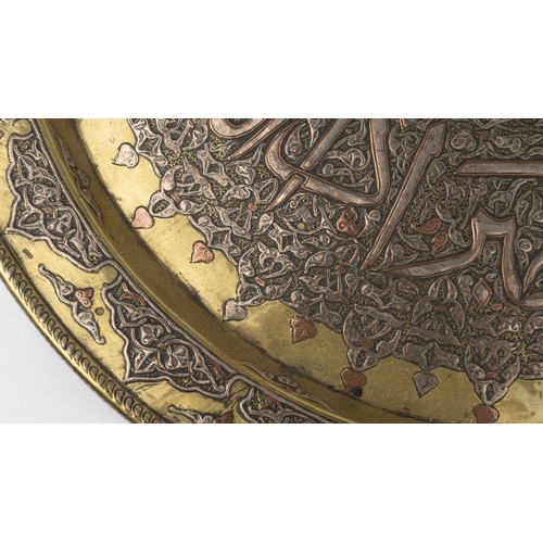 77 - AN OTTOMAN BRASS TRAY,
Of large circular form, resting on a flat, plain base, rising to a flattened,... 