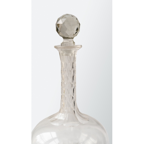 86 - A CUT GLASS DECANTER
Of bulbous form, resting a flat base and a star cut base, diamond facet cuts on... 