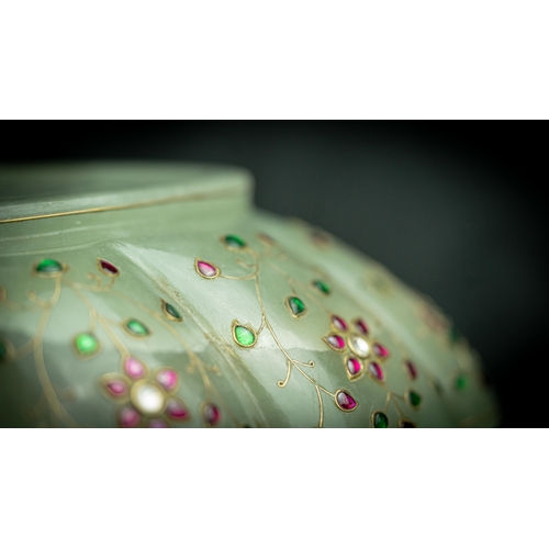 89 - A GEM SET MUGHAL STYLE BOWL, INDIA
Of oblong form, with lobed sides, carved in opaline rock crystal,... 