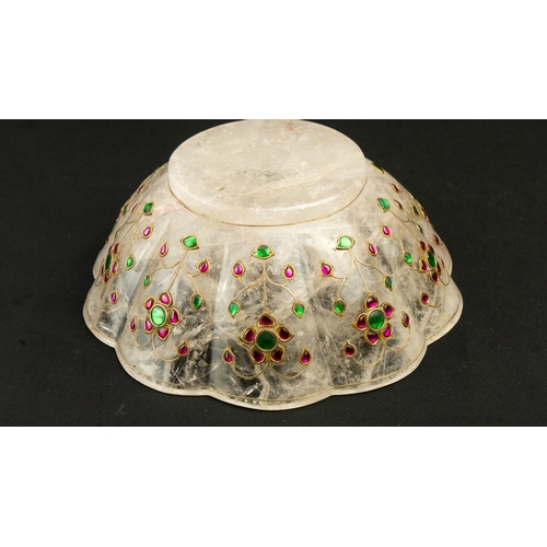 91 - AN INDIAN MUGHAL GEMSET ROCK CRYSTAL BOWL
A gem-set crystal lobed bowl, raised on short foot, embell... 