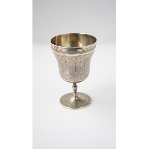 11 - A SILVER CUP Of flaring form, resting upon baluster stem with a flat circular foot, the exterior in ... 