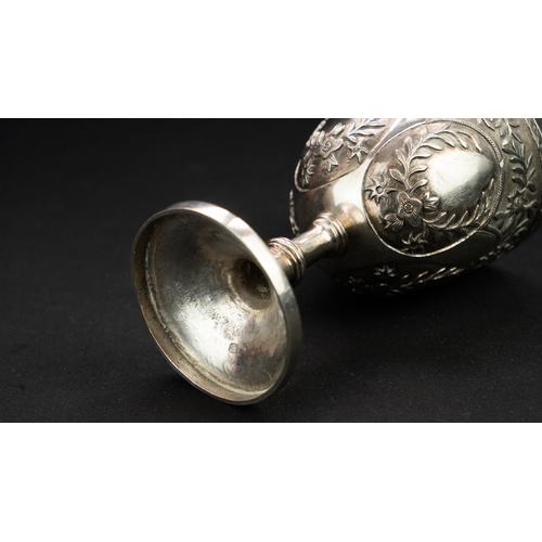 14 - A SILVER REPOUSSE GOBLET Of rounded circular form upon a stem with a central knop, resting on a spre... 