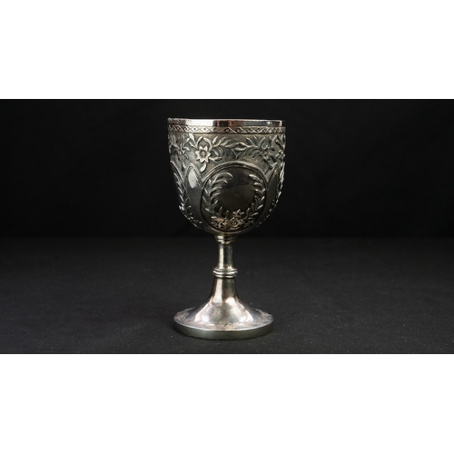 14 - A SILVER REPOUSSE GOBLET Of rounded circular form upon a stem with a central knop, resting on a spre... 