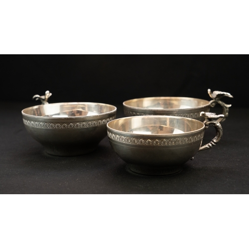 18 - A SET OF SILVER WATER CUPS Of inverted baluster circular form, resting on a flat base, S-scroll hand... 