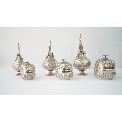 21 - A SET OF SIX SILVER  ORNAMENTS

THREE SILVER ROSE WATER SPRINKLER

Of globular form, rising to a nar... 