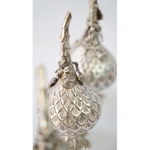 21 - A SET OF SIX SILVER  ORNAMENTS

THREE SILVER ROSE WATER SPRINKLER

Of globular form, rising to a nar... 