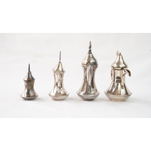 27 - A SET OF FOUR IRAQ SILVER DALLAH COFFEE POTS Of traditional shapes, silver coffee pots with long spo... 