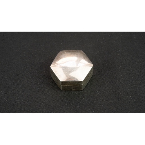 33 - A SILVER OCTAGONAL PILL BOX, Of octagonal form, with a pull-off lid, resting on a flat base, with a ... 