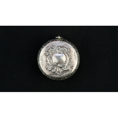 37 - A SILVER PENDANT TRINKET BOX 
A silver trinket box, serving as a pendant, of circular, bulbous form,... 