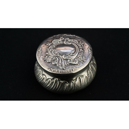 37 - A SILVER PENDANT TRINKET BOX 
A silver trinket box, serving as a pendant, of circular, bulbous form,... 