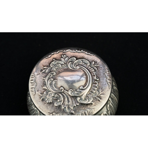 37 - A SILVER PENDANT TRINKET BOX 
A silver trinket box, serving as a pendant, of circular, bulbous form,... 