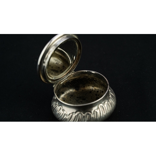 37 - A SILVER PENDANT TRINKET BOX 
A silver trinket box, serving as a pendant, of circular, bulbous form,... 