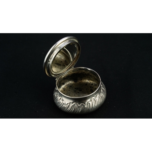 37 - A SILVER PENDANT TRINKET BOX 
A silver trinket box, serving as a pendant, of circular, bulbous form,... 