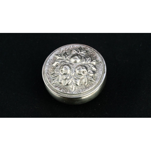 38 - A SILVER ROUNDED TRICKET BOX  Of circular, bulbous form, resting a flat base, with a pull-off lid, t... 