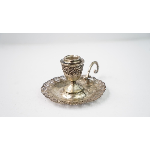 4 - A SILVER CANDLESTICK Of traditional form with a round base, a central stem and a sconce section, the... 