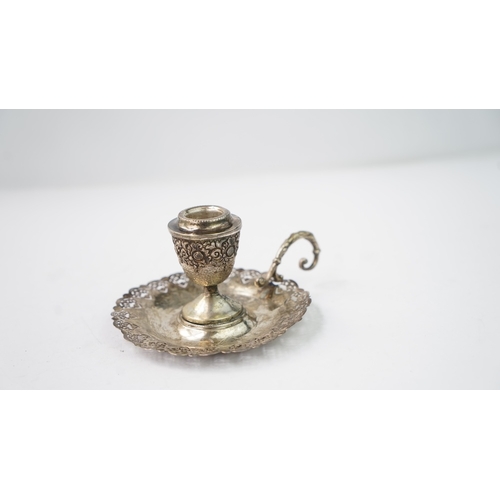 4 - A SILVER CANDLESTICK Of traditional form with a round base, a central stem and a sconce section, the... 