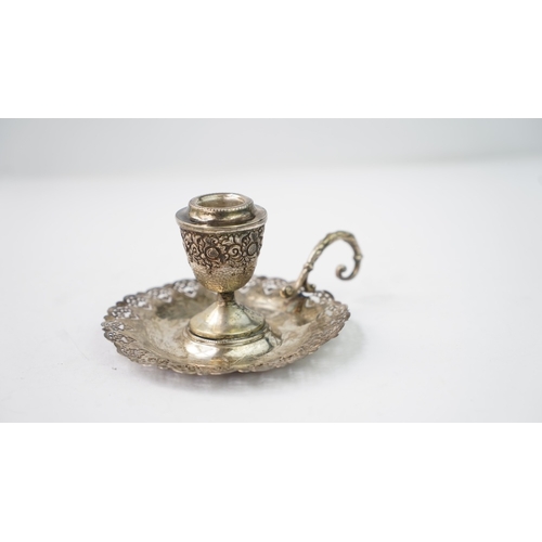 4 - A SILVER CANDLESTICK Of traditional form with a round base, a central stem and a sconce section, the... 