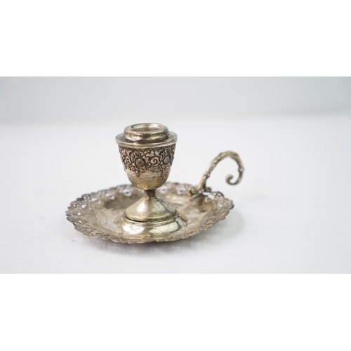 4 - A SILVER CANDLESTICK Of traditional form with a round base, a central stem and a sconce section, the... 