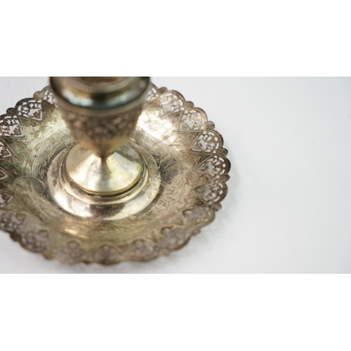 4 - A SILVER CANDLESTICK Of traditional form with a round base, a central stem and a sconce section, the... 