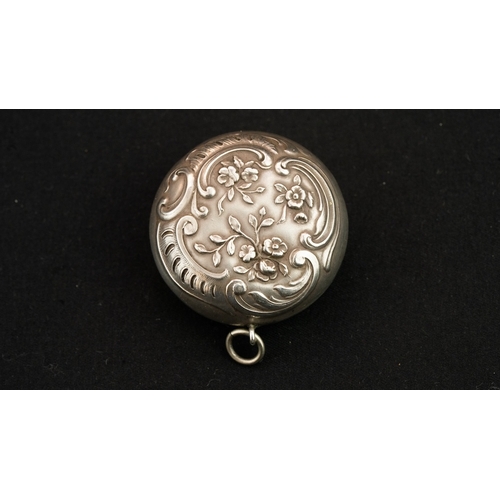 41 - A SILVER PENDANT TRINKET BOX  Of circular form, a pendant in the form of a trinket box, featuring a ... 