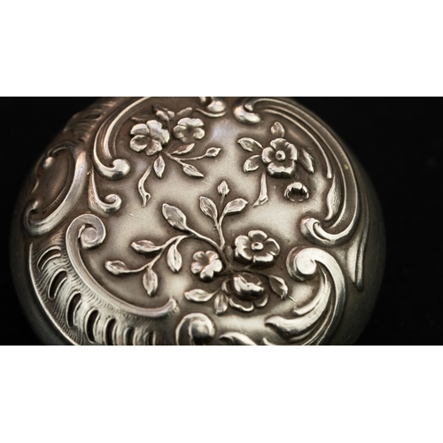 41 - A SILVER PENDANT TRINKET BOX  Of circular form, a pendant in the form of a trinket box, featuring a ... 