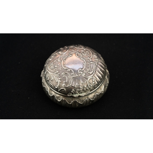 42 - A ROUND SILVER TRINKET BOX WITH A MIRROR Of rounded form the hinged opening to reveal a mirror, the ... 