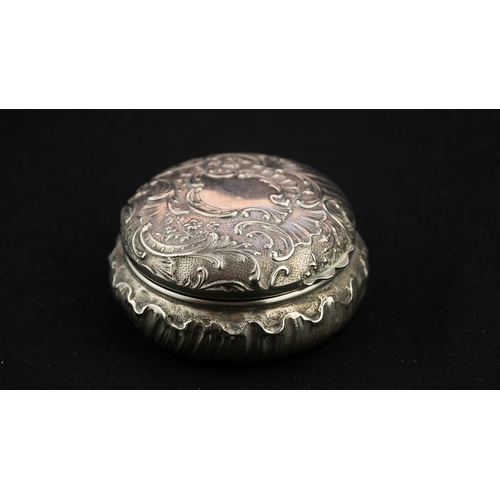 42 - A ROUND SILVER TRINKET BOX WITH A MIRROR Of rounded form the hinged opening to reveal a mirror, the ... 