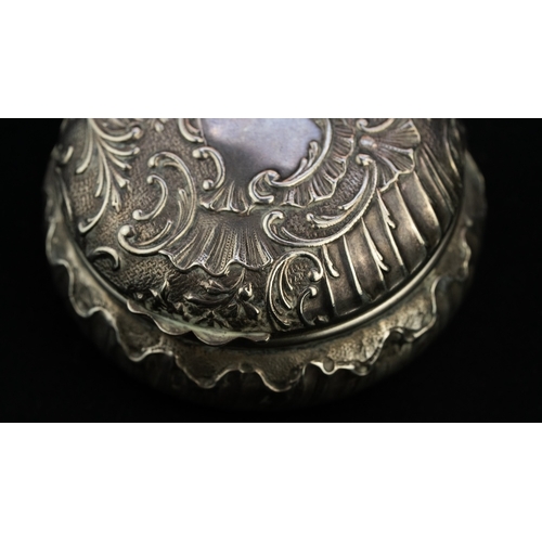 42 - A ROUND SILVER TRINKET BOX WITH A MIRROR Of rounded form the hinged opening to reveal a mirror, the ... 