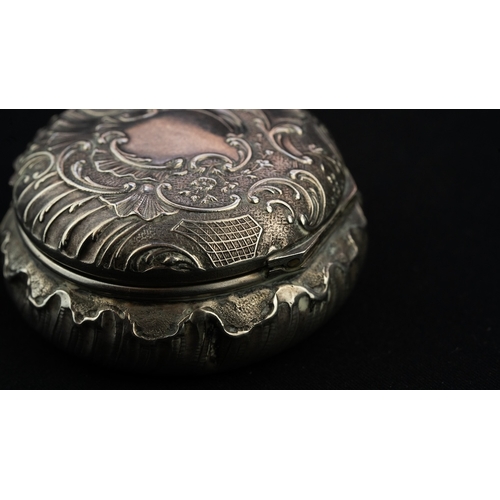 42 - A ROUND SILVER TRINKET BOX WITH A MIRROR Of rounded form the hinged opening to reveal a mirror, the ... 