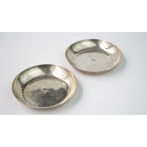 45 - A PAIR OF OTTOMAN SILVER PLATES  Of round form, resting on flat base, the exterior rim decorated wit... 