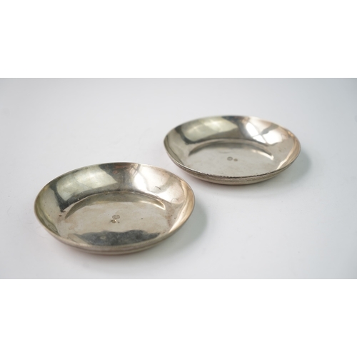 45 - A PAIR OF OTTOMAN SILVER PLATES  Of round form, resting on flat base, the exterior rim decorated wit... 