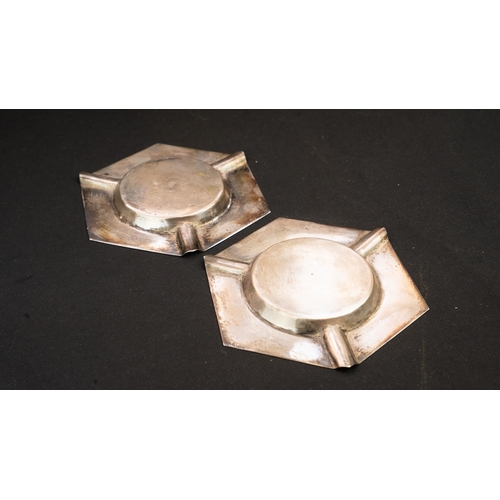 46 - A PAIR OF IRAQI/ MIDDLE EAST SILVER ASHTRAY 
 Comprising two plates, hexagonal shape, one with centr... 