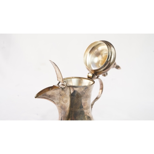 48 - A SILVER ARABIC COFFEE POT, MIDDLE EAST, OMAN Of traditional shape, a silver coffee pot with a long ... 