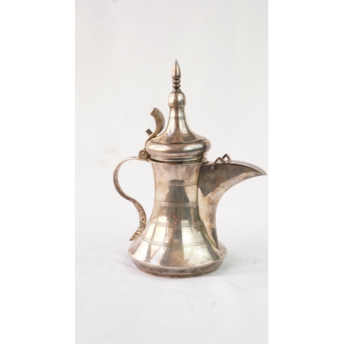 48 - A SILVER ARABIC COFFEE POT, MIDDLE EAST, OMAN Of traditional shape, a silver coffee pot with a long ... 