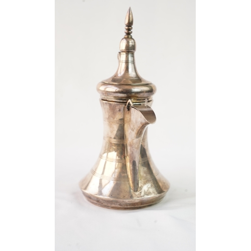 48 - A SILVER ARABIC COFFEE POT, MIDDLE EAST, OMAN Of traditional shape, a silver coffee pot with a long ... 