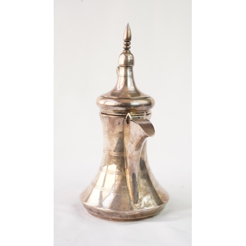 48 - A SILVER ARABIC COFFEE POT, MIDDLE EAST, OMAN Of traditional shape, a silver coffee pot with a long ... 