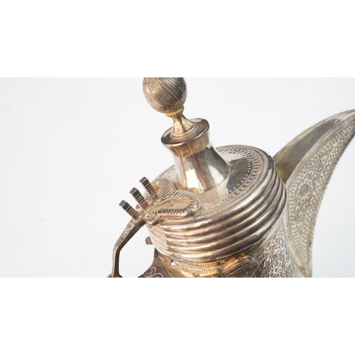 49 - A SILVER DALLAH COFFEE POT, PROBABLY EGYPT OR TUNISIA, EARLY 20TH CENTURY  Of typical form, with a b... 